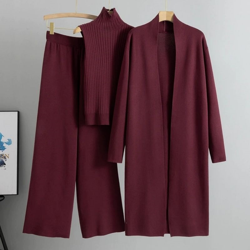 The autumn new laid-back and loose knitted set for women features a long shawl cardigan, a high-neck sweater and wide-leg pants, totaling three pieces