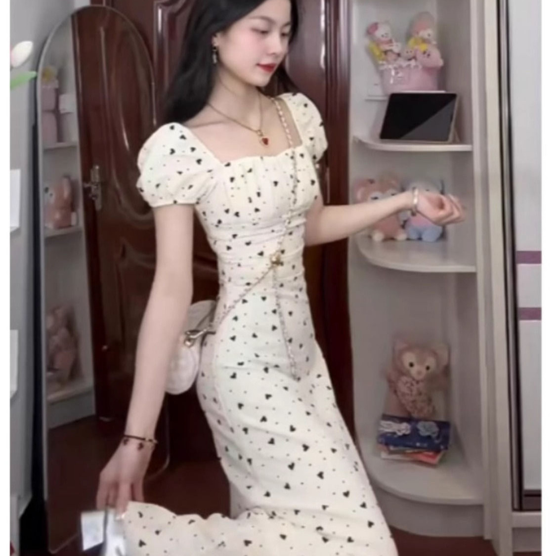 This summer's slim-fitting, high-end French-style square-neck floral polka dot maxi dress.