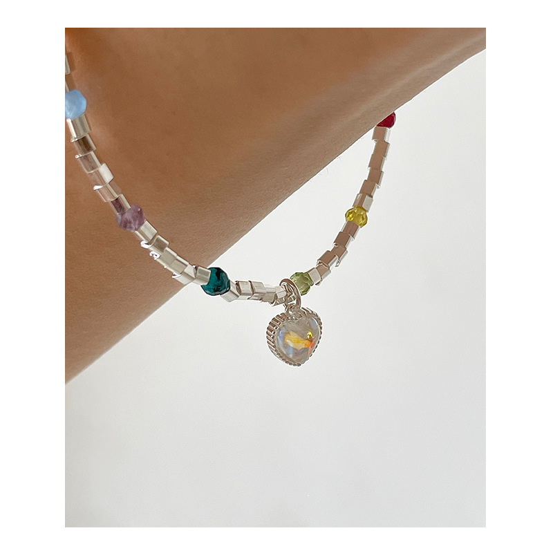 This handmade beaded red heart, bamboo-shaped, moonstone heart pendant necklace, a favorite of Korean Instagram influencers, exudes a sweet and elegant charm.
