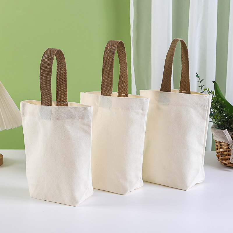 Customizable canvas tote bag with logo printing for milk tea, water bottle sleeves, portable bucket bag, and coffee canvas bag.