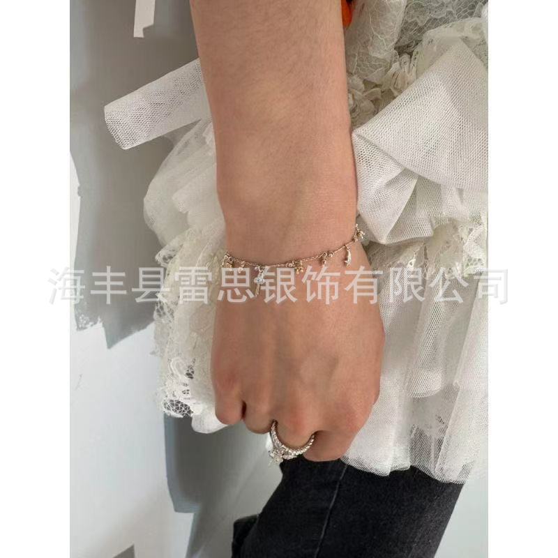 New design bracelet with sweet dream fragments, clouds, moon, stars, flowers, and key pendant; a fun and sweet bracelet for women.