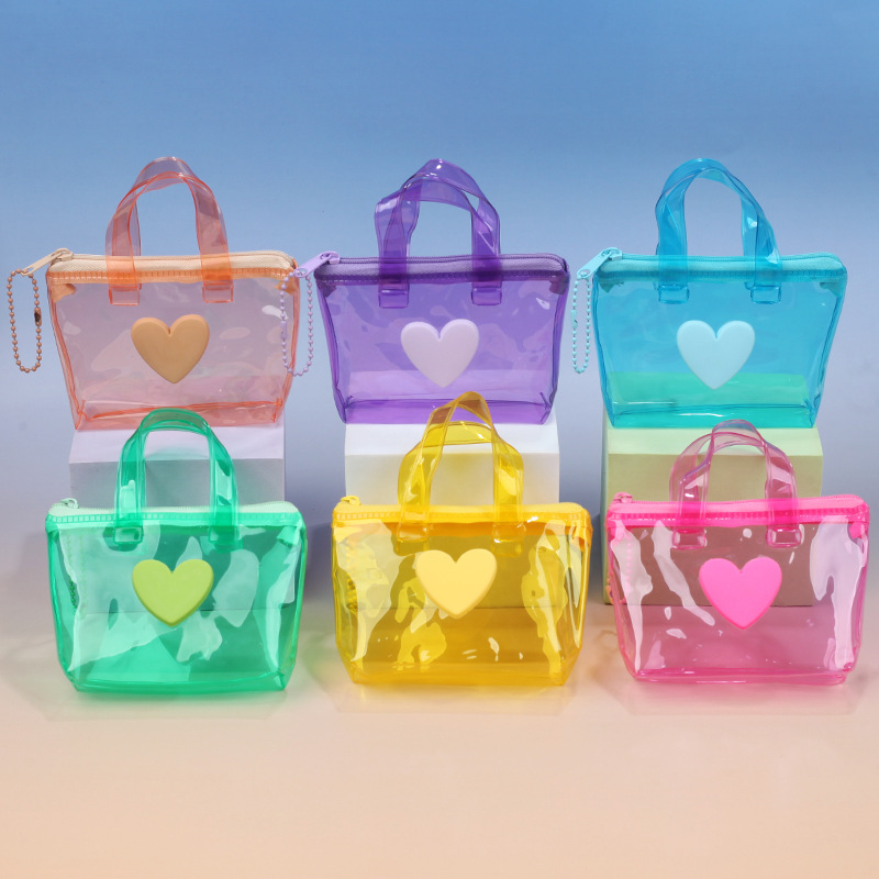 New mini portable jelly-colored heart-shaped transparent coin purse, creative card case, earphone storage bag, wholesale gift bag