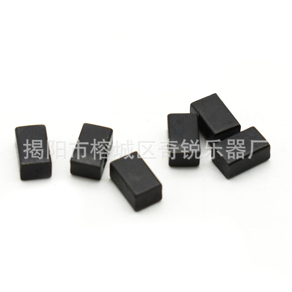 Vibrato string pressing system with embedded black iron block. Electric guitar double tremolo bridge. Double tremolo string pressing system.