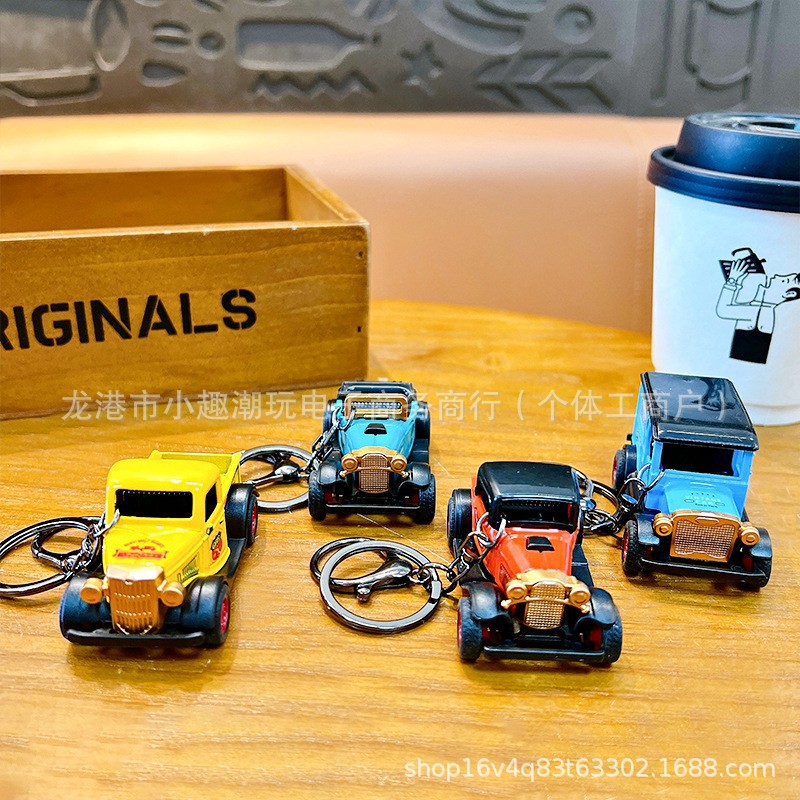 Mini cartoon model cars, electric scooters, motorcycle pendants, student bags, gifts, car sports cars, cool keychains for boys