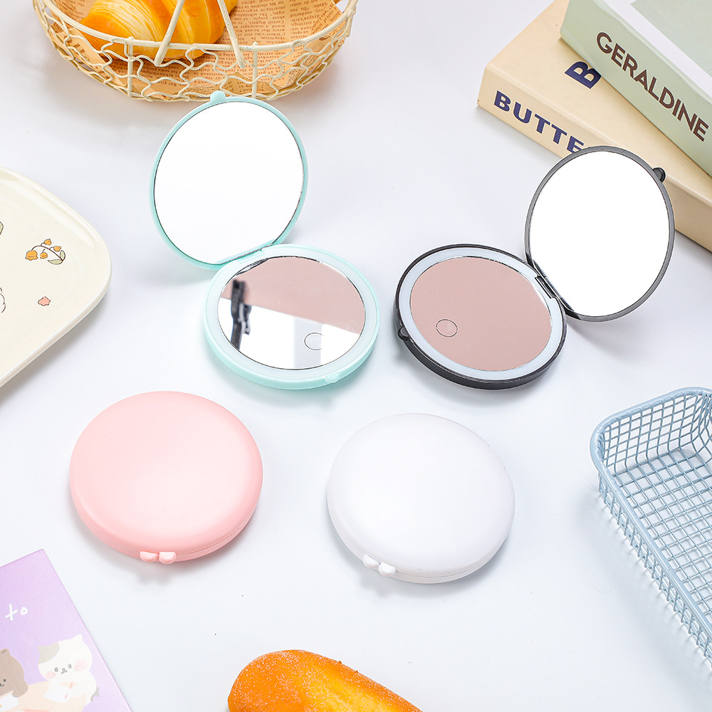 Mini portable folding LED round mirror, handheld 2x magnification, lighted makeup mirror, portable and cute beauty mirror.