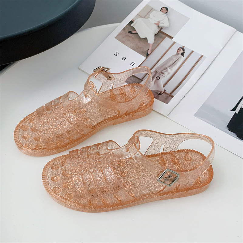 Summer Roman-style flat transparent beach sandals, fashionable hollow flat heel, casual Chanel-style sandals for women.