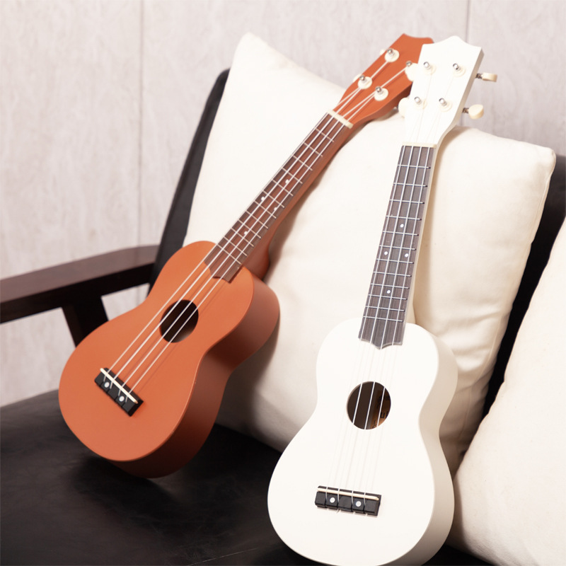 Ukulele, a playable beginner instrument, a mini guitar, made of colored carbon fiber, 21-inch and 23-inch.