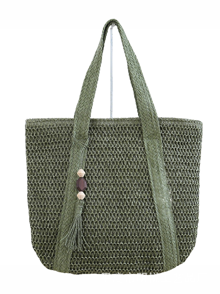 Forest-style artistic straw woven bag, solid color, fresh and large capacity, summer vacation tassel beach handbag, women's tote bag wholesale.