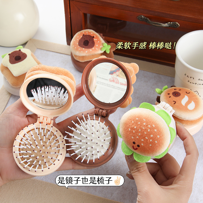 Wholesale of cartoon capybara plush air cushion comb, portable mini hanging accessory hair comb, and folding airbag comb for girls