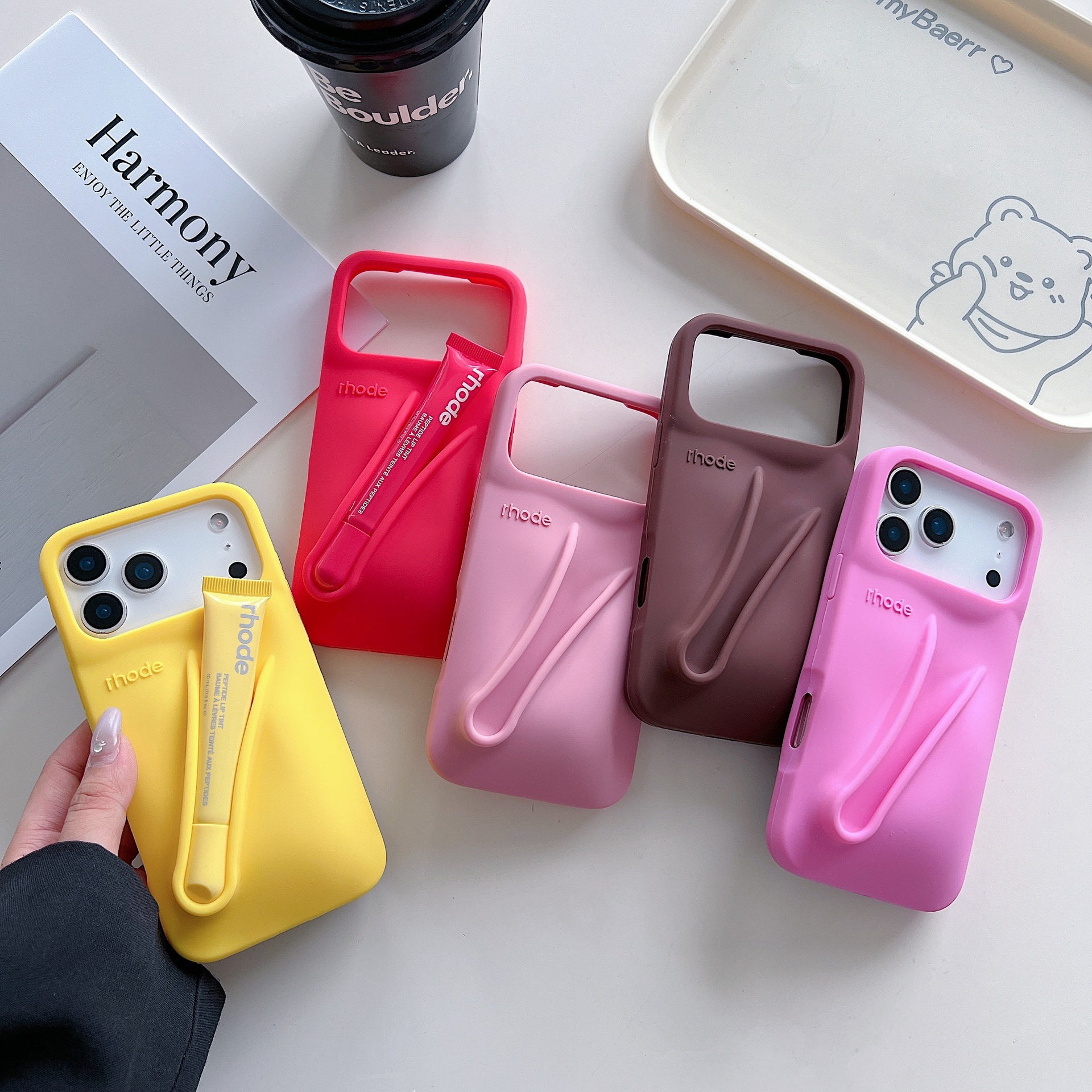 Hailey's Rhode lipstick holder iPhone 17 case, Apple series phone case, 16/15 Pro Max silicone, 13mm.