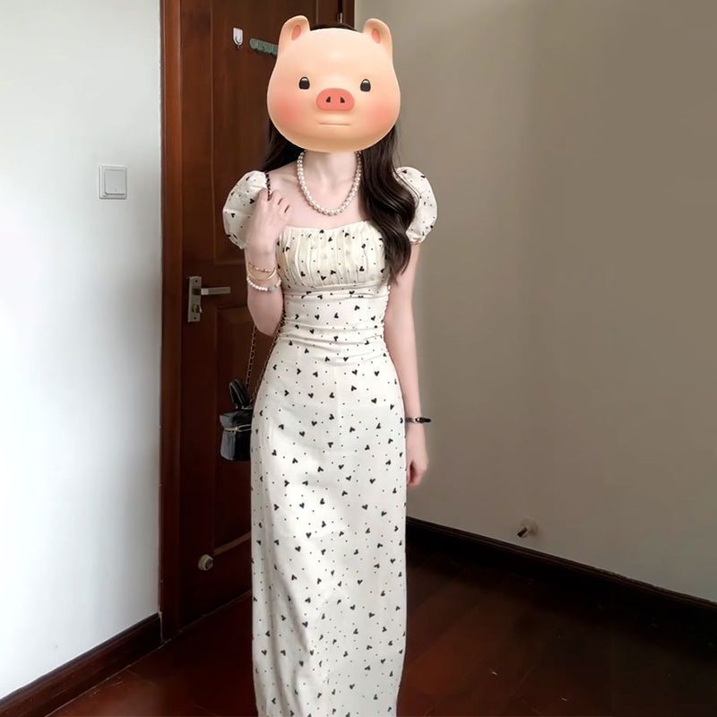 A gentle French-style high-end dress for women in the early spring of 2026, featuring a petite and elegant floral print long dress