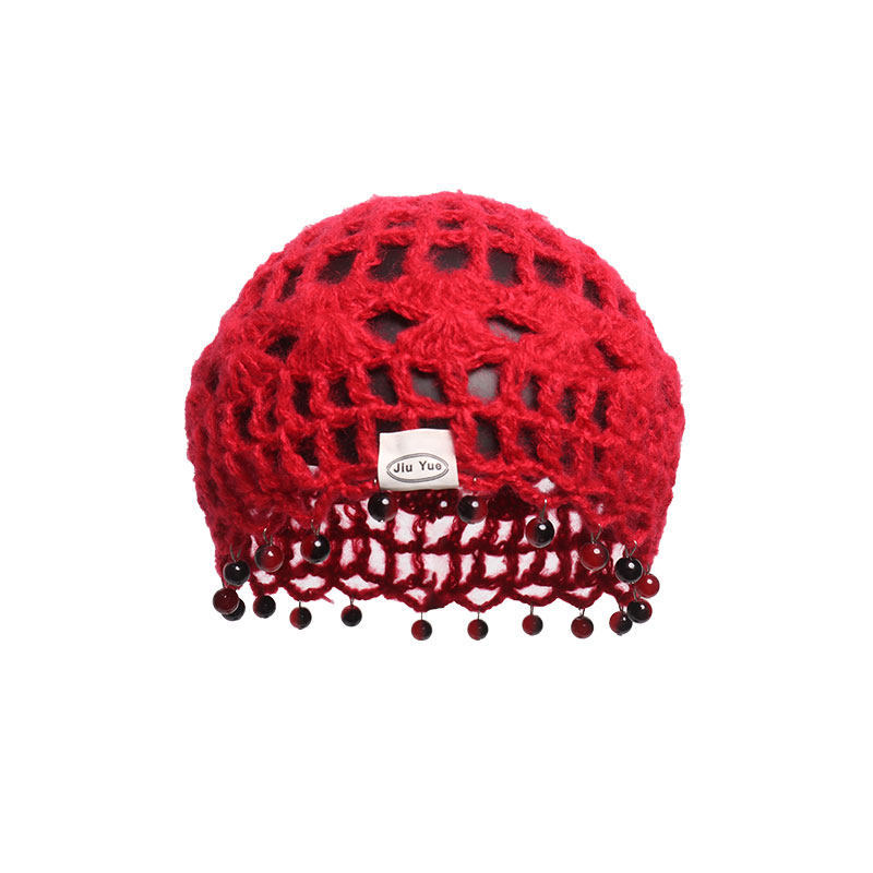 A Japanese-style retro hollowed-out knitted headscarf with a female ethnic style, a small blue pullover hat that shows off the face during a trip to western Sichuan