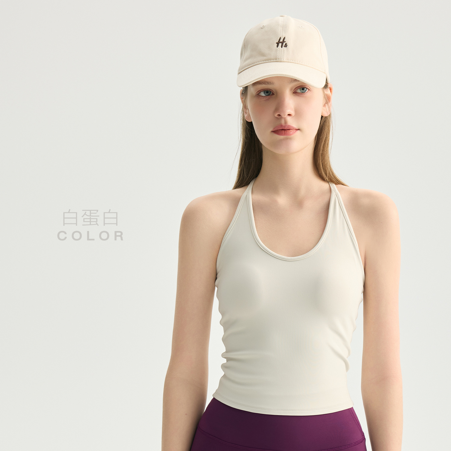 Women's sports vest with padded bra, featuring a sleek back and designed for a flattering silhouette. No bra needed. Supports cups. Suitable for yoga, fitness, and can be worn as outerwear.