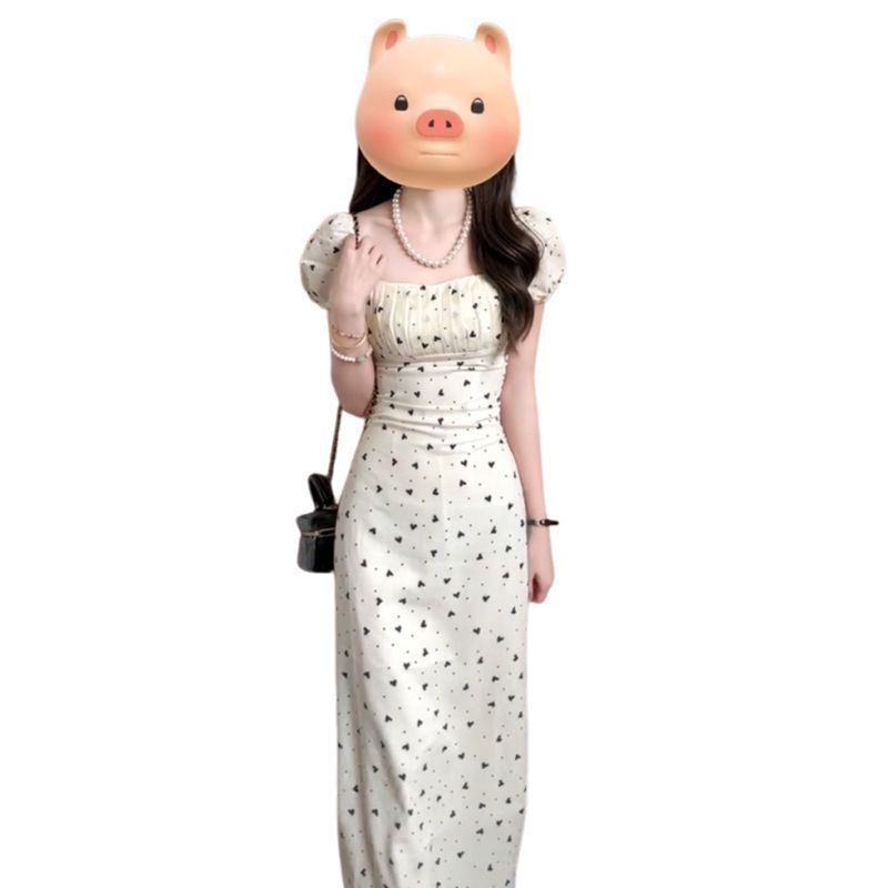 A gentle French-style high-end dress for women in the early spring of 2026, featuring a petite and elegant floral print long dress