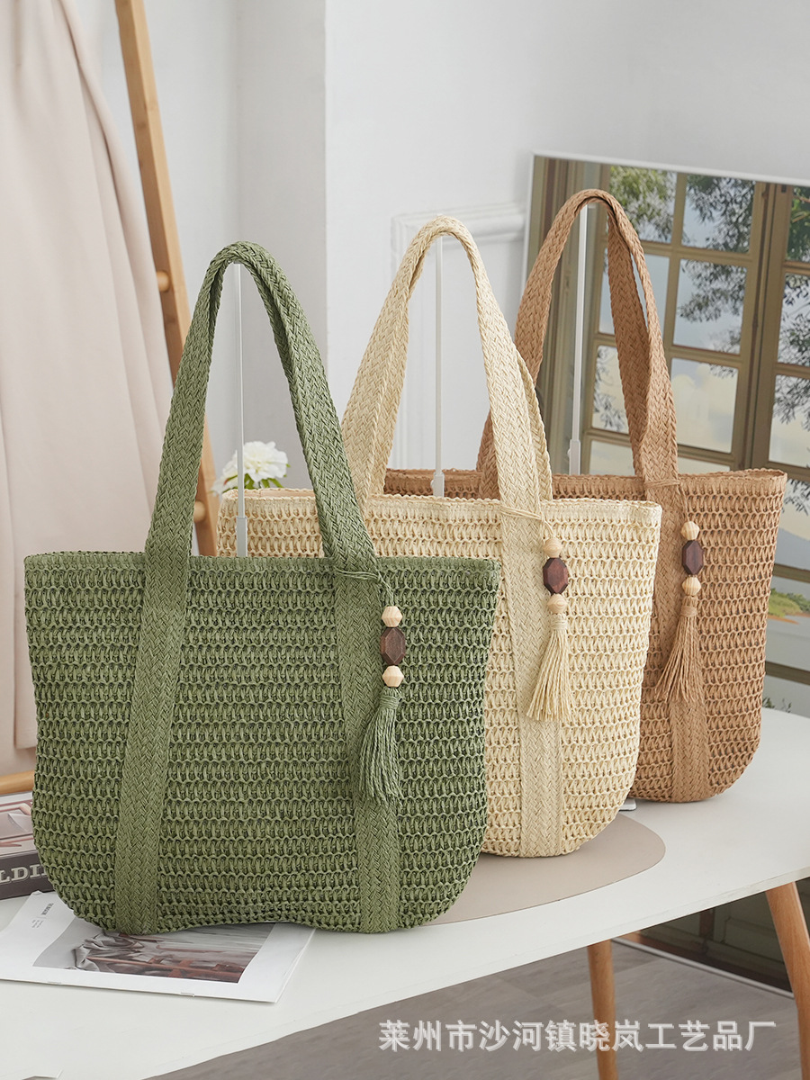 Machine-woven fabric paper rope woven bag, fashionable shoulder bag, straw bag, peach wood pendant tassel beach bag, women's Chinese style bag