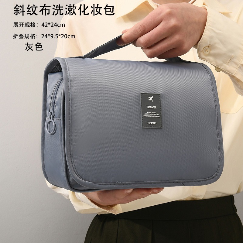 Travel-sized toiletry bag with twill hooks, large capacity cosmetic bag with compartments for organizing cosmetics and skincare products, perfect for business trips.