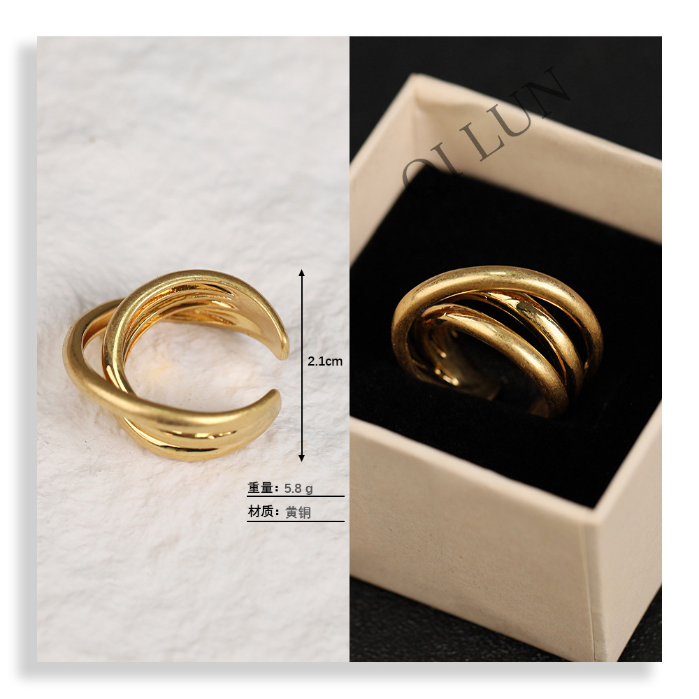 This ring features a unique, geometric, three-dimensional design, a distinctive style, and a touch of understated luxury. It has a sophisticated, vintage-inspired design.