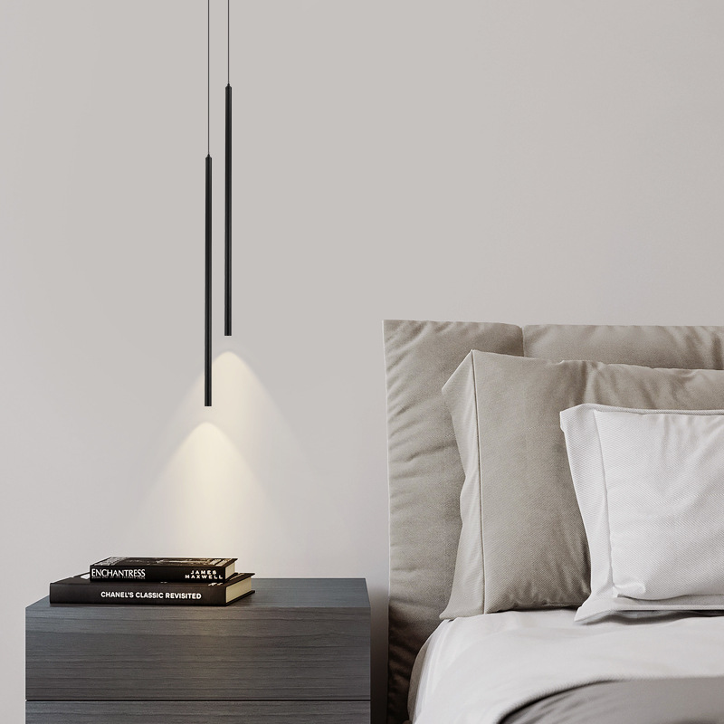 The bedside pendant lamp in the bedroom features a minimalist linear ultra-slender line lamp with a modern and simple Nordic style. It is a background wall lamp for the master bedroom