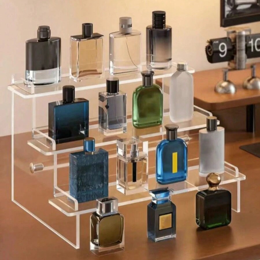 Acrylic display stand (K) for cosmetics, perfume, and figurines.