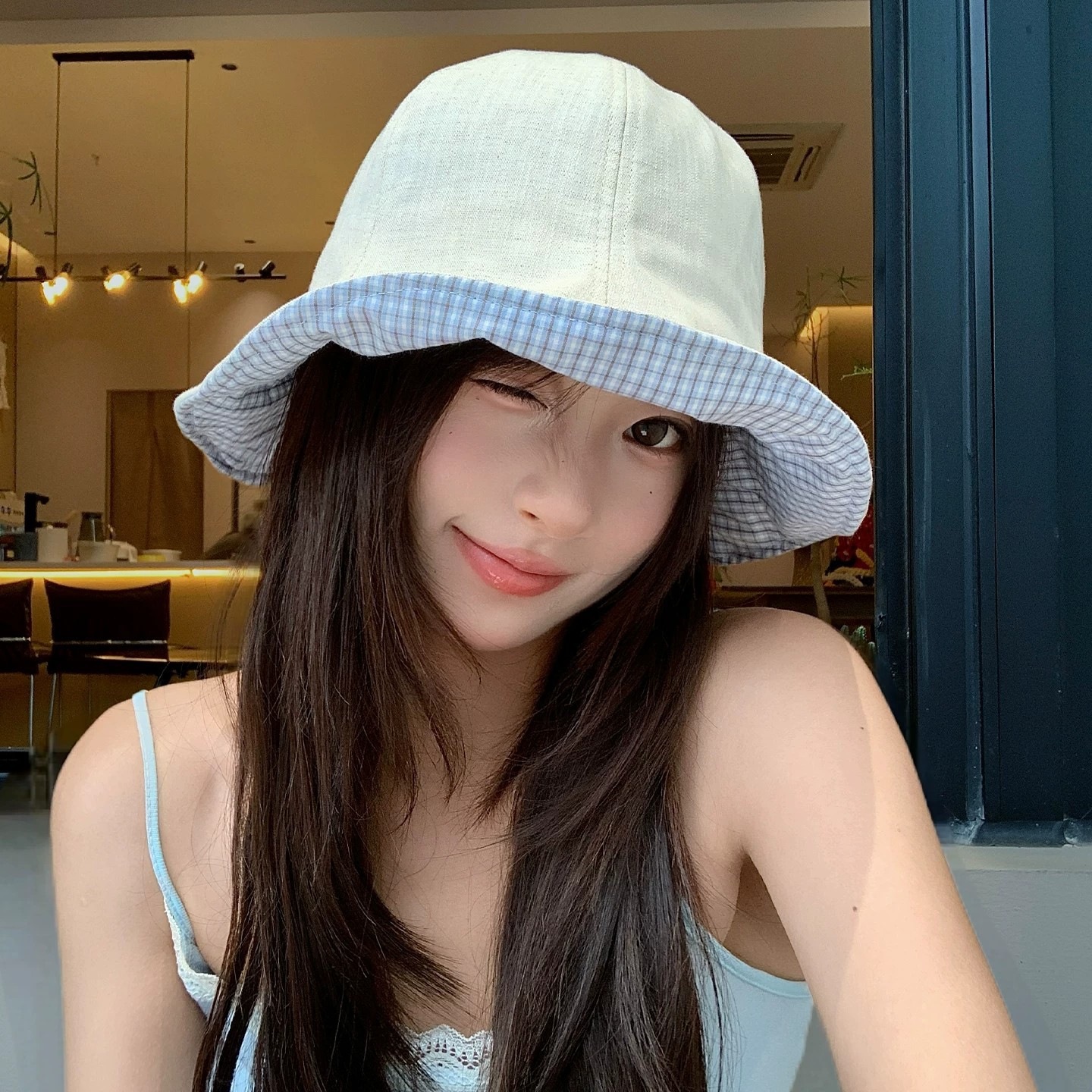 Korean style double-sided plaid fisherman's hat, women's summer 2026 new style, versatile, makes face look smaller, outdoor travel sun protection hat.