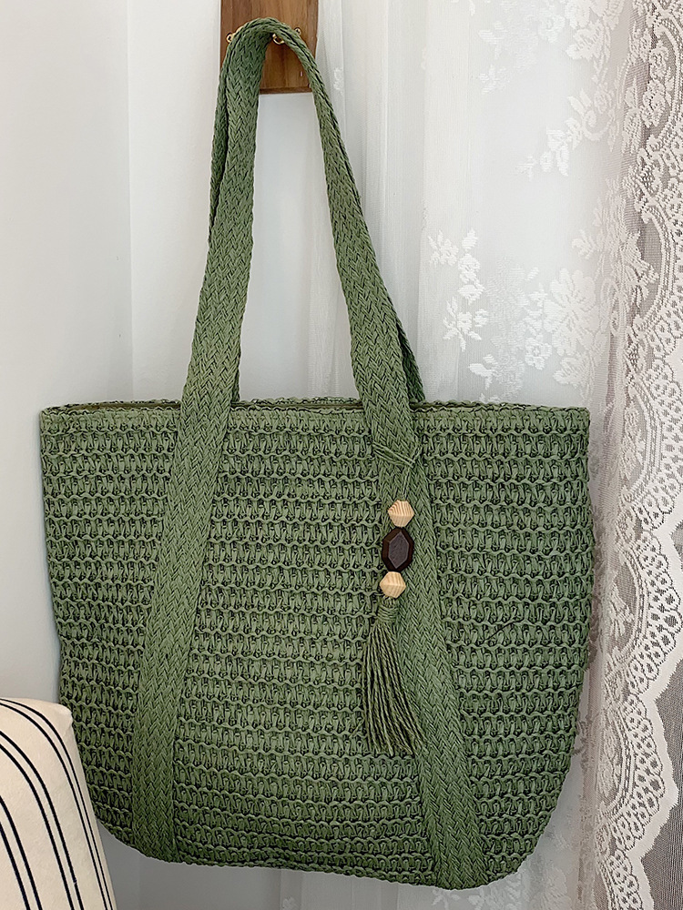 Large capacity beach bag for women, new spring 2026 style, casual and unique tassel straw woven commuter tote bag.