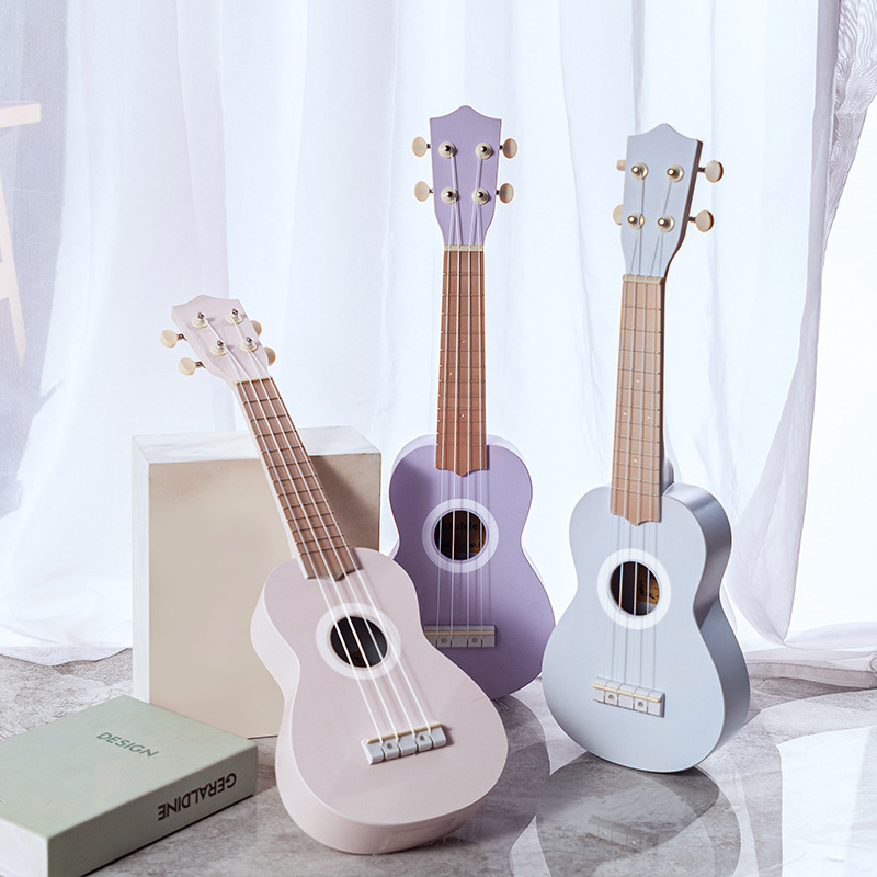 23-inch ukulele, a playable musical instrument, a mini guitar, a gift ukulele with patterned logo.