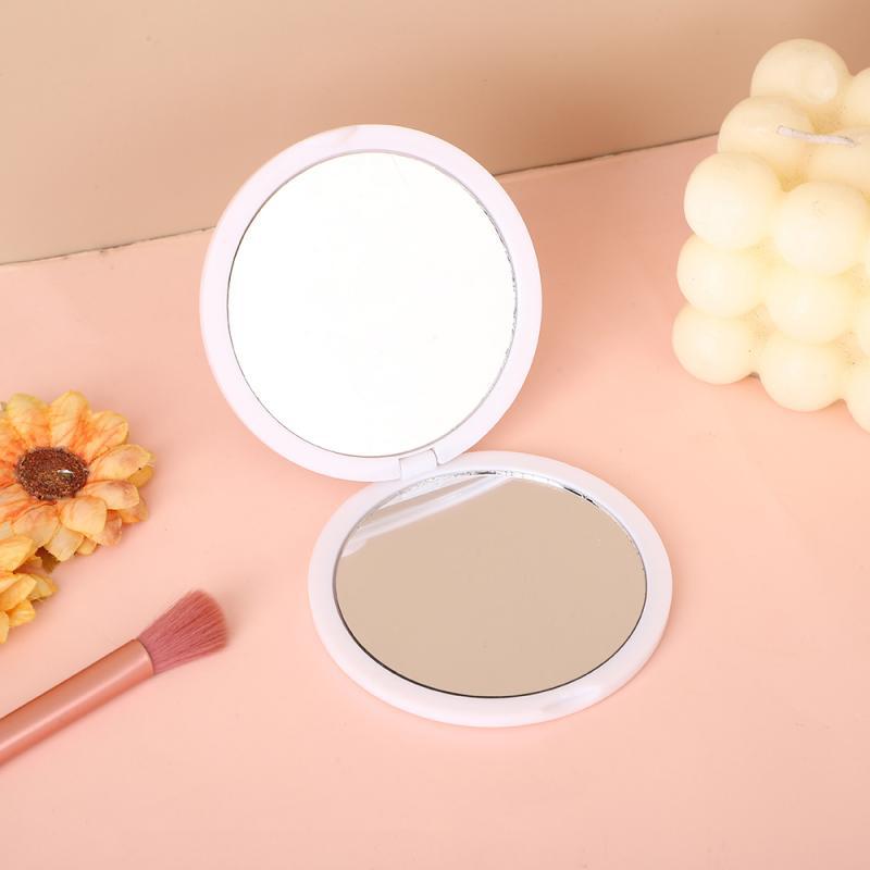 Foldable double-sided small round mirror, portable makeup mirror, butter-coated flip-top, small personal mirror, customizable with logo or pattern printing.