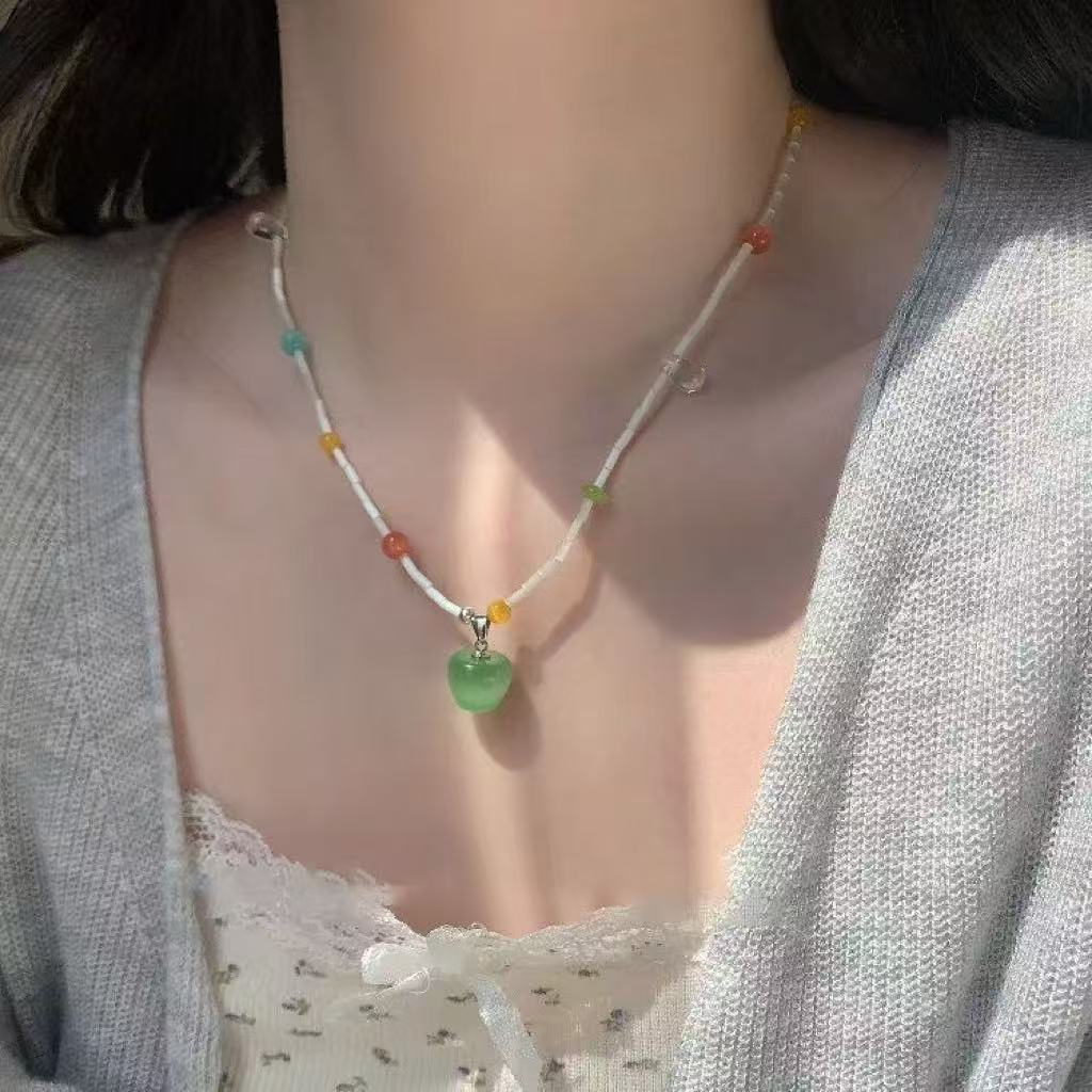 Dopamine-enhanced colorful apple woven necklace, new style, cute and unique, long halter neck sweatshirt chain pendant accessory.