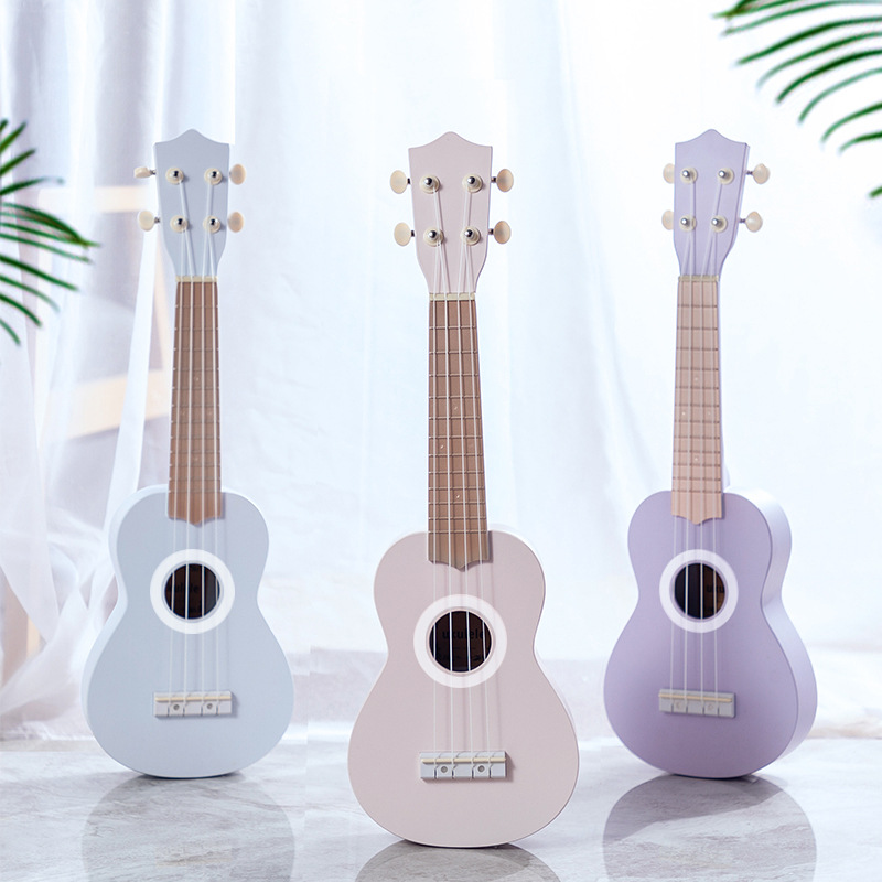 21-inch ukulele, a playable musical instrument, a mini guitar, a gift ukulele with patterned logo.