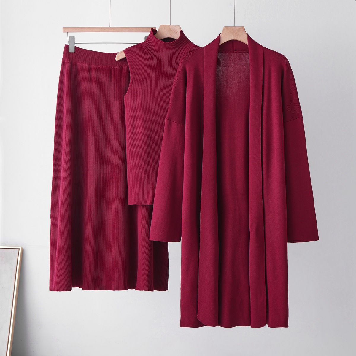 Cross-border casual knitted cardigan set for women's autumn and winter new laid-back style loose coat, vest and skirt three-piece set