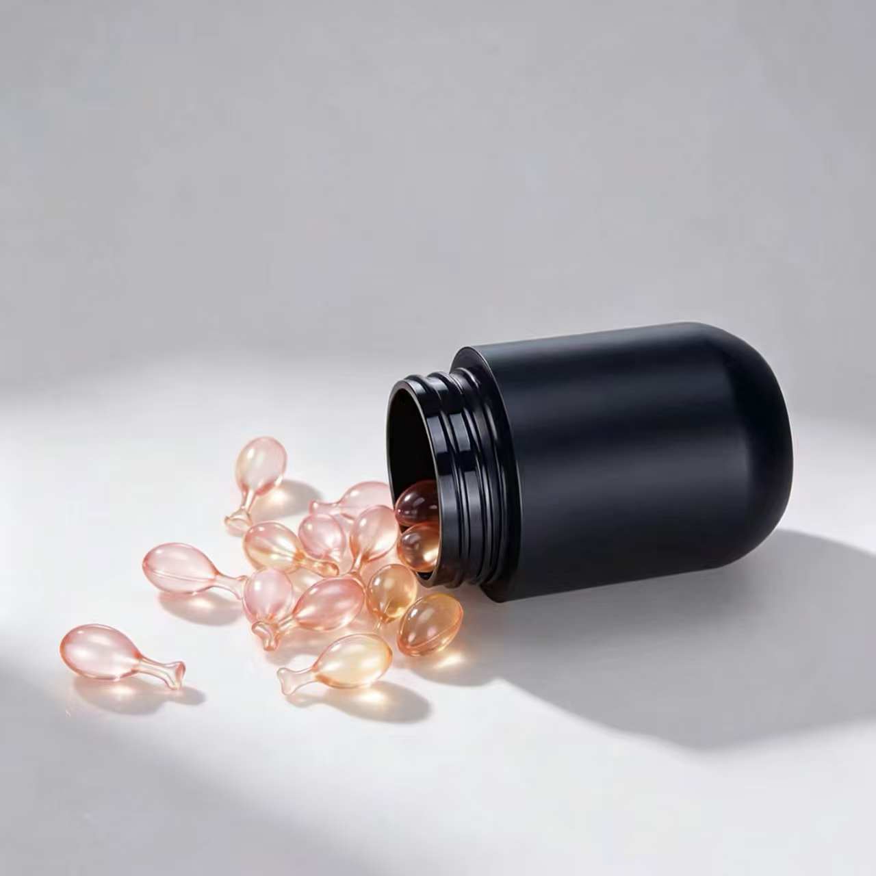 Black gold-rimmed capsule bottle with a bullet tip, cosmetic dispensing bottle, lotion essence, plastic packaging, empty bottle, capsule bottle